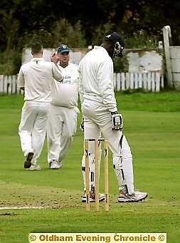 RICHARD Doherty and Anthony Edden, of Shaw, high five after the wicket of Stayley’s overseas amateur Dane Currency. 
