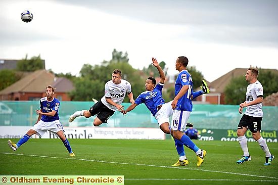 ACROBATICS . . . from dynamic Athletic skipper Korey Smith (second from right). 