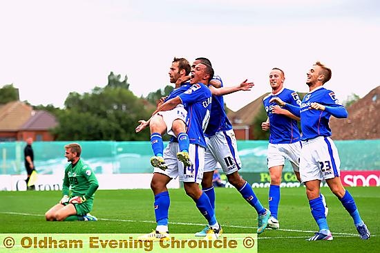 WELL DONE, MATE: James Dayton is lifted off the ground by Jonson Clarke-Harris, watched by his Athletic team-mates, following his superb goal.
WELL DONE, MATE: James Dayton is lifted off the ground by Jonson Clarke-Harris, watched by his Athletic team-mates, following his superb goal.