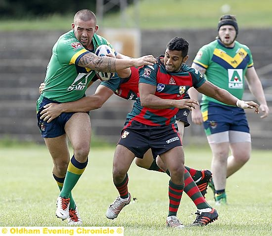 ON THE CHARGE . . . Matthew Haggarty powers forward for Oldham. 