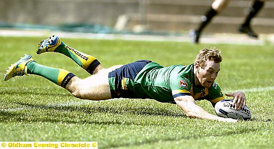 HAT-TRICK STAR . . .Richard Lepori dives in for his first try. 
