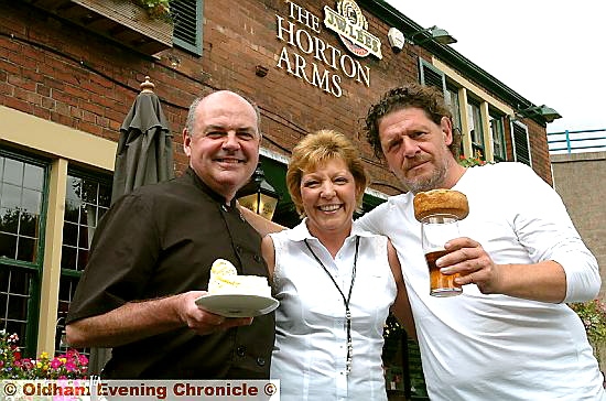 Celebrity chef Marco Pierre White with landlord Alistair Wolf (left) landlady Debra Tatlow and the popular pie 
