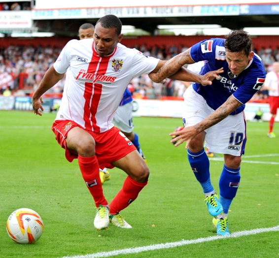CHARLIE MacDONALD (right) proved a handful for Stevenage. 