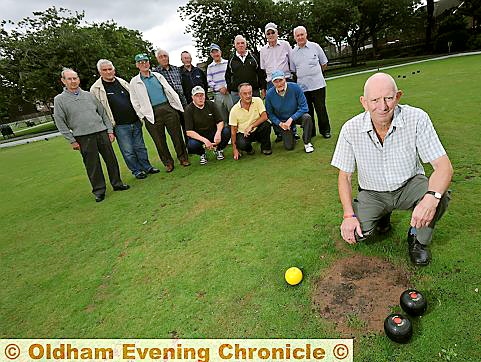 ROUGH patch: club captain Malcolm Talbot (front) and his fellow team mates on the damaged green ROUGH patch: club captain Malcolm Talbot (front) and his fellow team mates on the damaged green