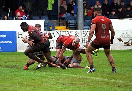 Mo Agoro (with ball) crossed twice for Oldham, but it wasn’t enough 