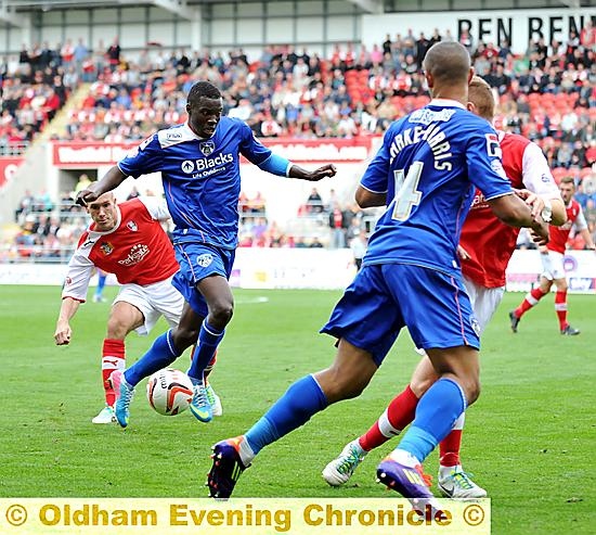 DEFENSIVE AID: Genseric Kusunga (left) in action at Rotherham. 