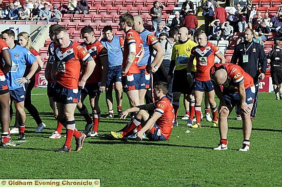 AGONY: dejected Oldham players at the end of the game 