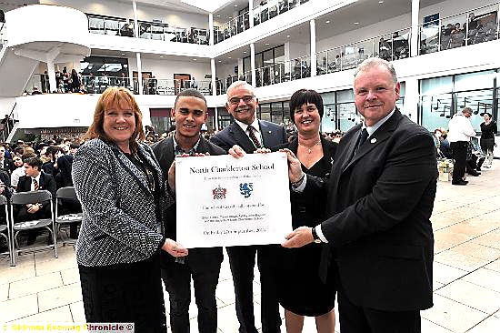 PROUD day: from left, Gillian Hindle (business manger), Ashley John-Baptiste, Garvin Crabtree (chair of the governors), Joy Clark (Head), and librarian Trevor Brown. Picture: Vincent Brown 
