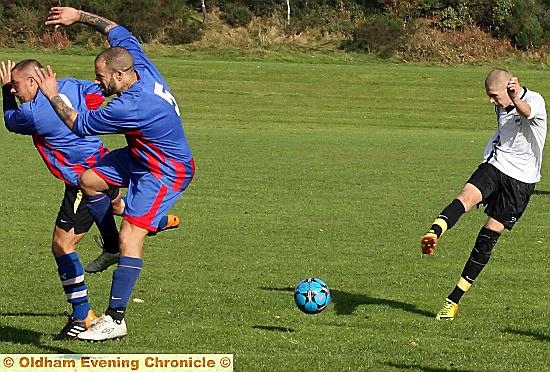 Matt Hamilton of Oldham blasts the ball just off target. 