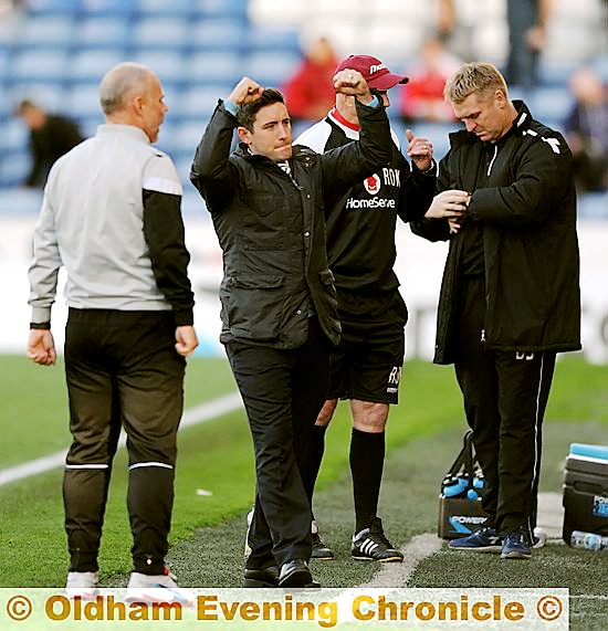 OH YES: boss Lee Johnson celebrates at the final whistle after his Athletic side held on for a 2-1 win.