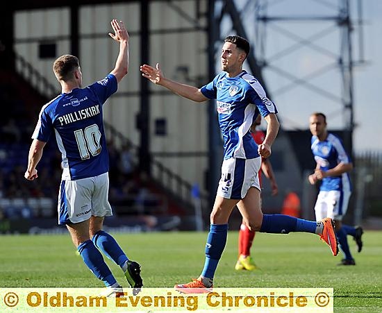 PUT IT THERE: Conor Wilkinson (right) gets a high five from front-line partner Danny Philliskirk after his goal. 