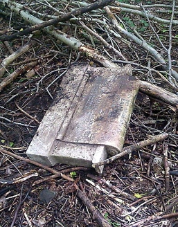 DUMPED . . . a discarded headstone