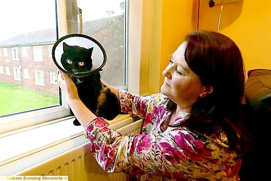 Lorraine Wilson with her injured cat Princess