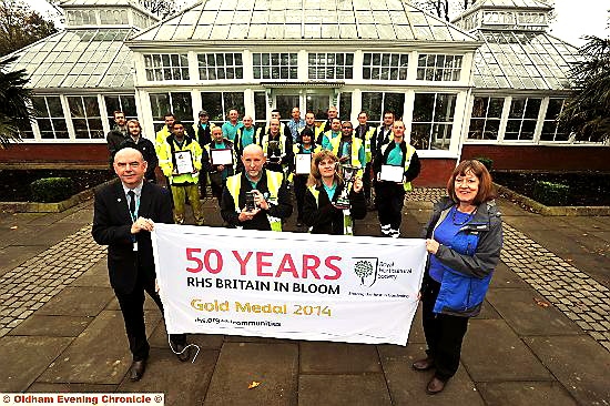 TROPHIES galore: celebrating success are (front from the left), Glenn Dale (head of parks and gardens), glasshouse operatives Andrew Wakeman and Andrea Blackman with two of the trophies, and Councillor Barbara Brownridge, cabinet member for neighbourhoods and co-operatives