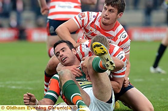 GETTING TO GRIPS . . . Lewis Palfrey in the thick of the Grand Final action.