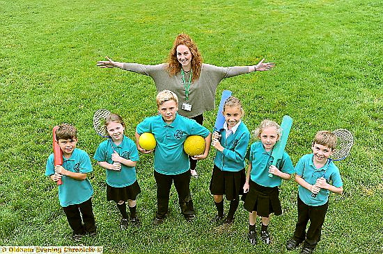 CELEBRATIONS: pupils, from left, Oliver Bentley, Phoebe Elgin, Sebastian Eastwood, Phoebie Skidmore, Sadie Bardsley and Thomas Frankovitch with PE co-ordinator Fay Wilson