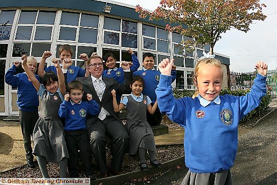 ACADEMY celebration: Rosy Sylvestor-Jessop (front) celebrated with fellow pupils and executive head teacher Gordon Leach