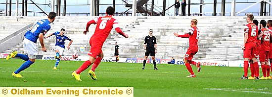 DEFINING MOMENT . . . Mike Jones floats a free-kick over Orient’s defensive wall and into the net for the only goal of the game.