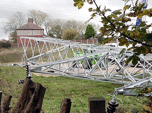 DISMANTLED . . . down comes the old pylon