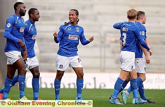 INSTANT IMPACT: Daniel Johnson (centre) celebrates his debut goal with his new team-mates.