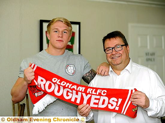 GREAT TO HAVE YOU . . . Roughyeds chairman Chris Hamilton with George Tyson after the player put pen to paper