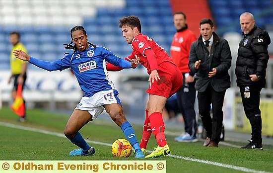 ADMIRING GLANCES . . . Athletic boss Lee Johnson (in the background) wss clearly impressed with a piece of skill from his namesake, Daniel, in the game against Crawley