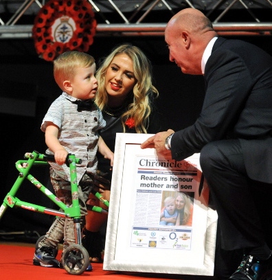 David Whaley presents an award to Leo Stott and mum Cara Oldham at the Pride in Oldham Awards. David’s great week was soon to end though