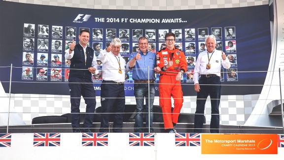 CALENDAR SUPPORT: (l-r) Berndt Maylander (FIA F1 Safety Car Driver) Herbie Blash (FIA Assistant Race Director) Paul, his son and fellow marshal Liam, and FIA race director Charlie Whiting at this year’s British GP at Silverstone.