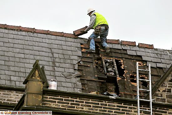 Fire started by accident by workmen at Christ Church, Friezland.

Workers after fire was put out.