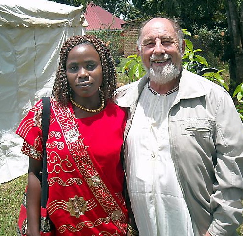 Bee keeper Bob Holland and Justine Mbabazi