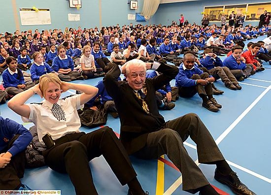 EXCITED schoolchildren — plus Chief Superintendent Kath Hankinson and Mayor Cllr. John Hudson — do their bit for the world record bid 
