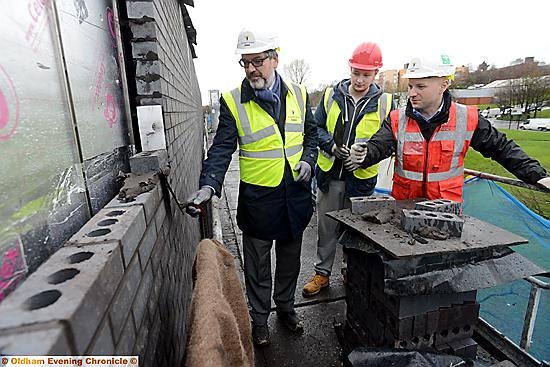 Alun Francis (college principal), apprentice student Alex Kerrigan (16), Neil O'Brien (project lead Willmott Dixon) at the topping out at Oldham College.