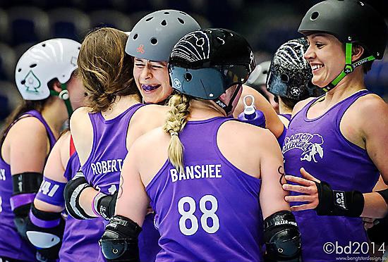 Victory celebration by the Rainy City roller derby team.