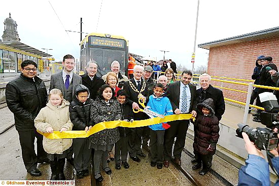 OFFICIALLY open: Oldham’s Mayor John Hudson with pupils from St Patrick’s and civic leaders cut the ribbon 
