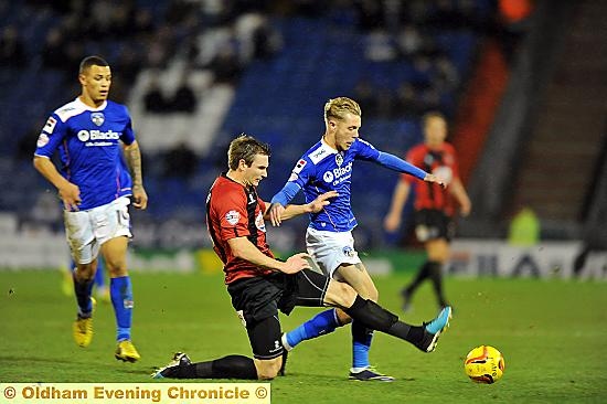 ATHLETIC substitute Kirk Millar is beaten to the ball. 