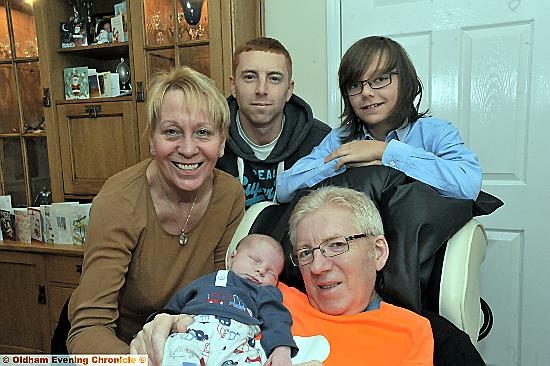 TOGETHER ... Eric Armitage holds his two-week-old grandson Isaac and family members (l-r) Angela Armitage, Graeme Armitage and Jamie Brewis. 