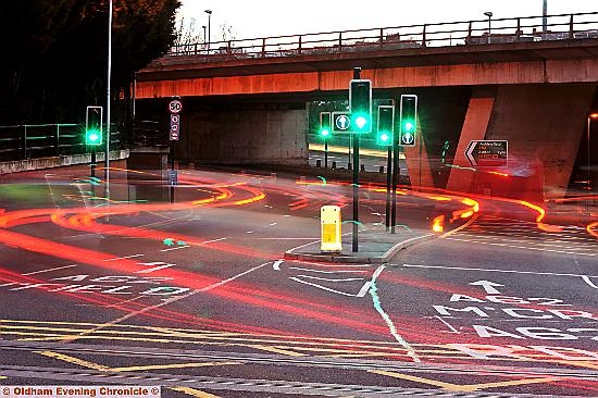 CUT ACROSS. . . a long-exposure image shows the wrong routes vehicles are taking around the new mini traffic.