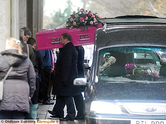 TRAGIC . . . Annalise’s pink coffin is carried into the crematorium 