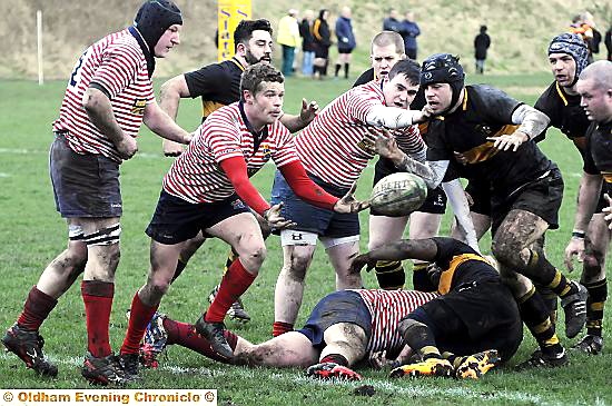 CATCH THAT . . . Will Mellor tries to get Oldham moving against Didsbury. 