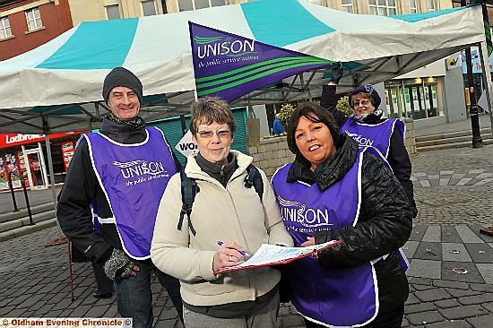 SIGN here . . . local organiser John Sharp, Janet Evans, who signed the petition, branch secretary Julie Finnigan, and Unison member Wendy Bradbury 
