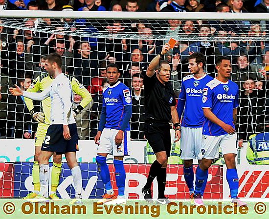 OFF YOU GO . . . referee Stephen Martin shows Athletic forward Jonson Clarke-Harris the red card for deliberate handball. 