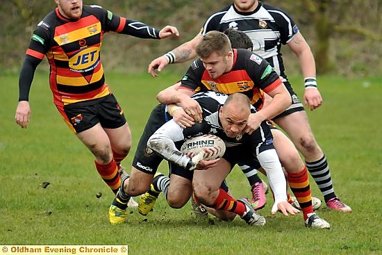 Ian Sinfield takes the tackle for Rangers. 