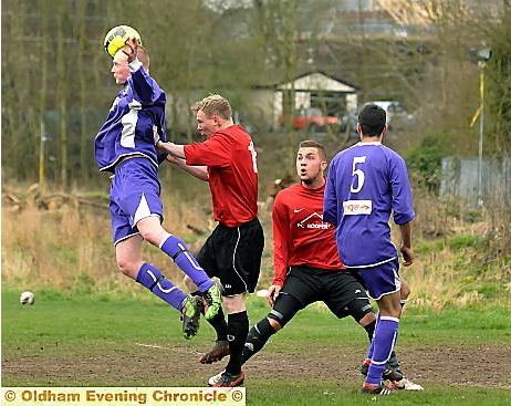 James Curley (second, left), of Rifle Range ‘A’, and team-mate Lee Mallitt (third, left) battle for the ball against Springhead Libs ‘A’.
James Curley (second, left), of Rifle Range ‘A’, and team-mate Lee Mallitt (third, left) battle for the ball against Springhead Libs ‘A’.