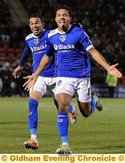 CAPTAIN MARVEL . . . Korey Smith, chased by Connor Brown and Adam Lockwood, wheels away in delight after scoring a superb late equaliser for Athletic last night. 