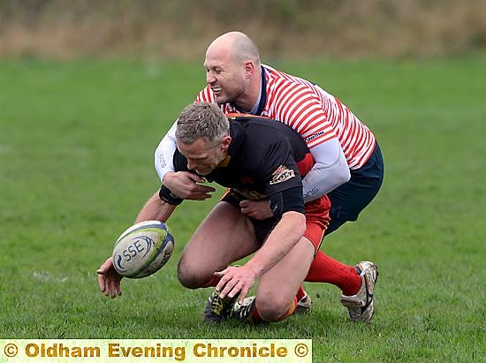 NO YOU DON’T . . . Gareth Barber stops a De La Salle raider in his tracks. 