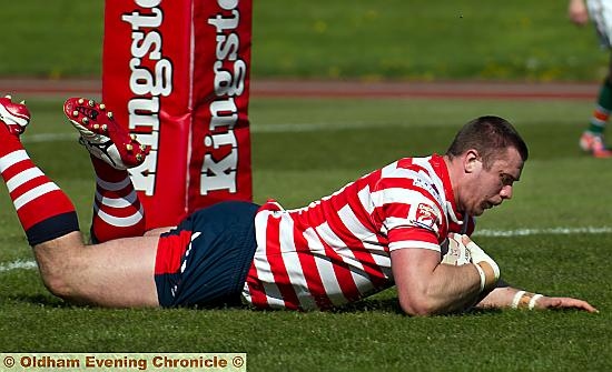 ALEX Davidson dives in to record Oldham’s second try, and is mobbed by his team-mates (top) after reducing the deficit to 18-12. PICTURES by Stephen Gaunt, touchlinepics.com 
