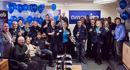 CELEBRATION: Pam Pelham pours herself some bubbly surrounded by family, colleagues and business contacts. 
