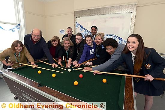 POCKETING cash . . . Lynda Winrow (youth development officer), Councillor John Dillon, Charlotte Gill (community safety officer), Jeanette Booth (assistant youth worker), PC Adam Murphy, Chloe Martin, Kashif Ashraf, PCSO Donna Wheeler, Joseph Beeston (Royton and Crompton youth forum chairman) and Lilly Maloney at Shaw Youth Centre 
