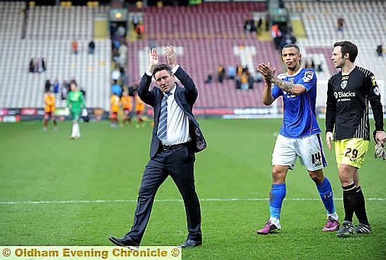 JOB WELL DONE: Lee Johnson (left), Jonson Clarke-Harris and Paul Rachubka walk off the field after Athletic’s 3-2 win over Bradford. 