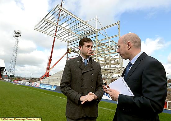 STAND up for progress . . . council leader Jim McMahon (centre) with Latics chairman Simon Corney. 